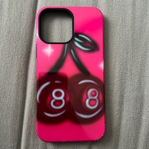 This is a 13 Pro Max phone case. It is pink with 8 ball cherries.